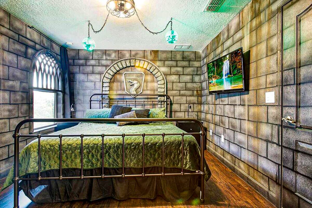 Stone archway, serpent crest, emerald light pouring in from every direction. The