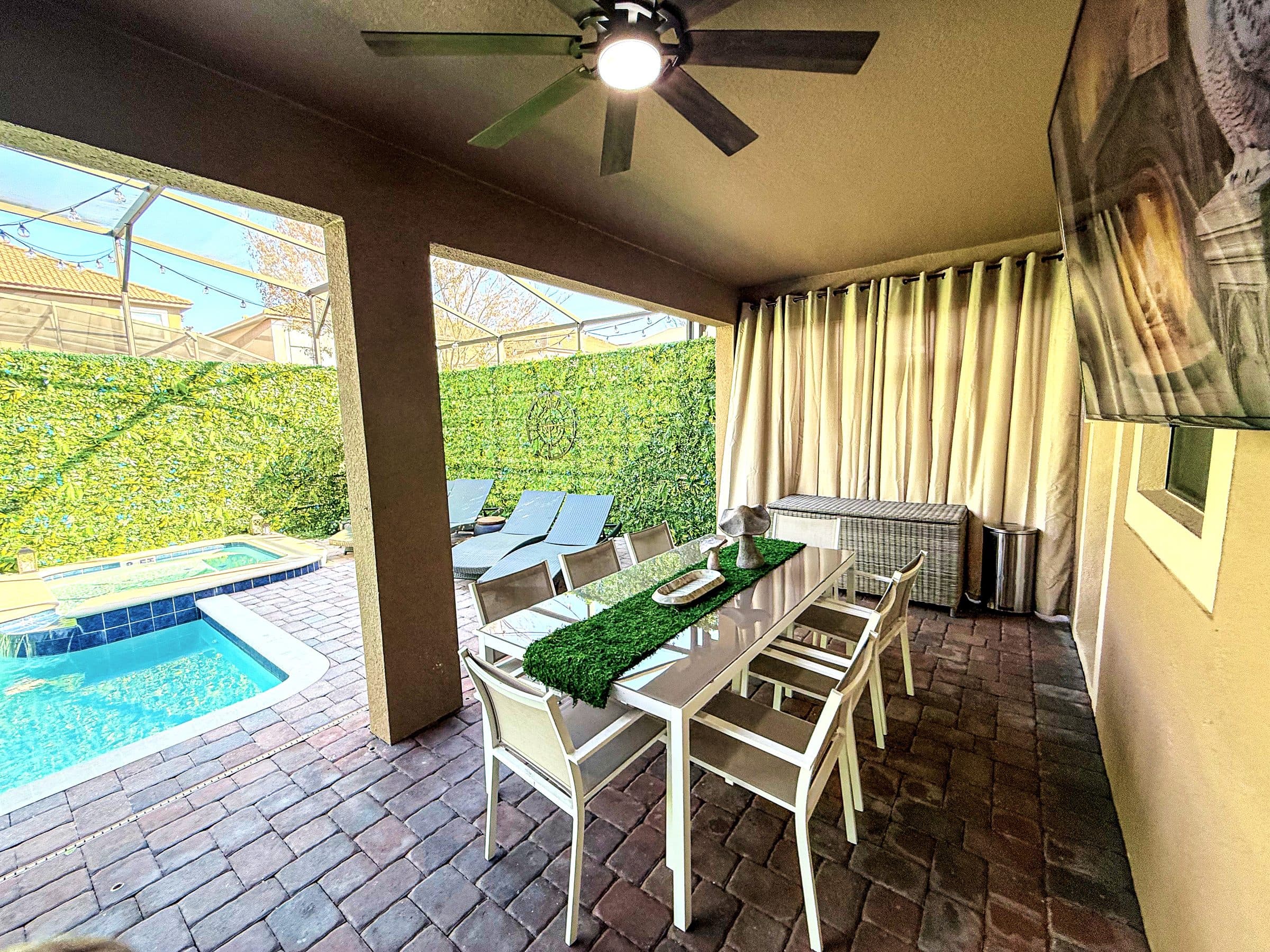 Covered dining table for eight with a turf runner and hand-carved stone mushroom