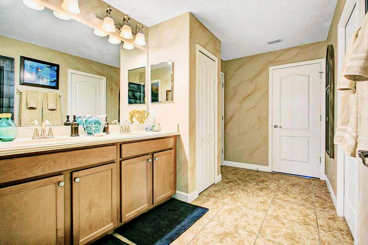 Stained-glass windows inspired by Moaning Myrtle's bathroom, golden sandstone walls, du