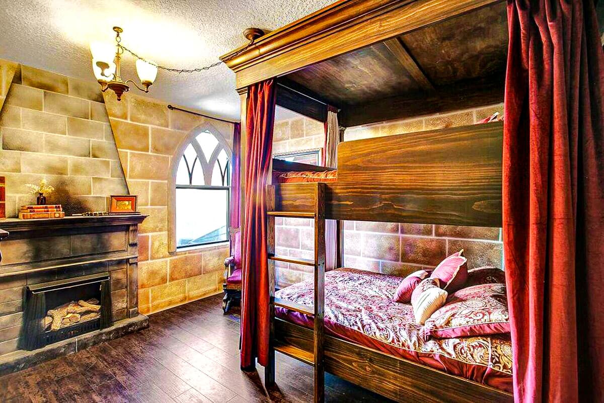 Brave enough to sleep in a tower inspired by Gryffindor? Stone hearth, crimson curtains, a pat