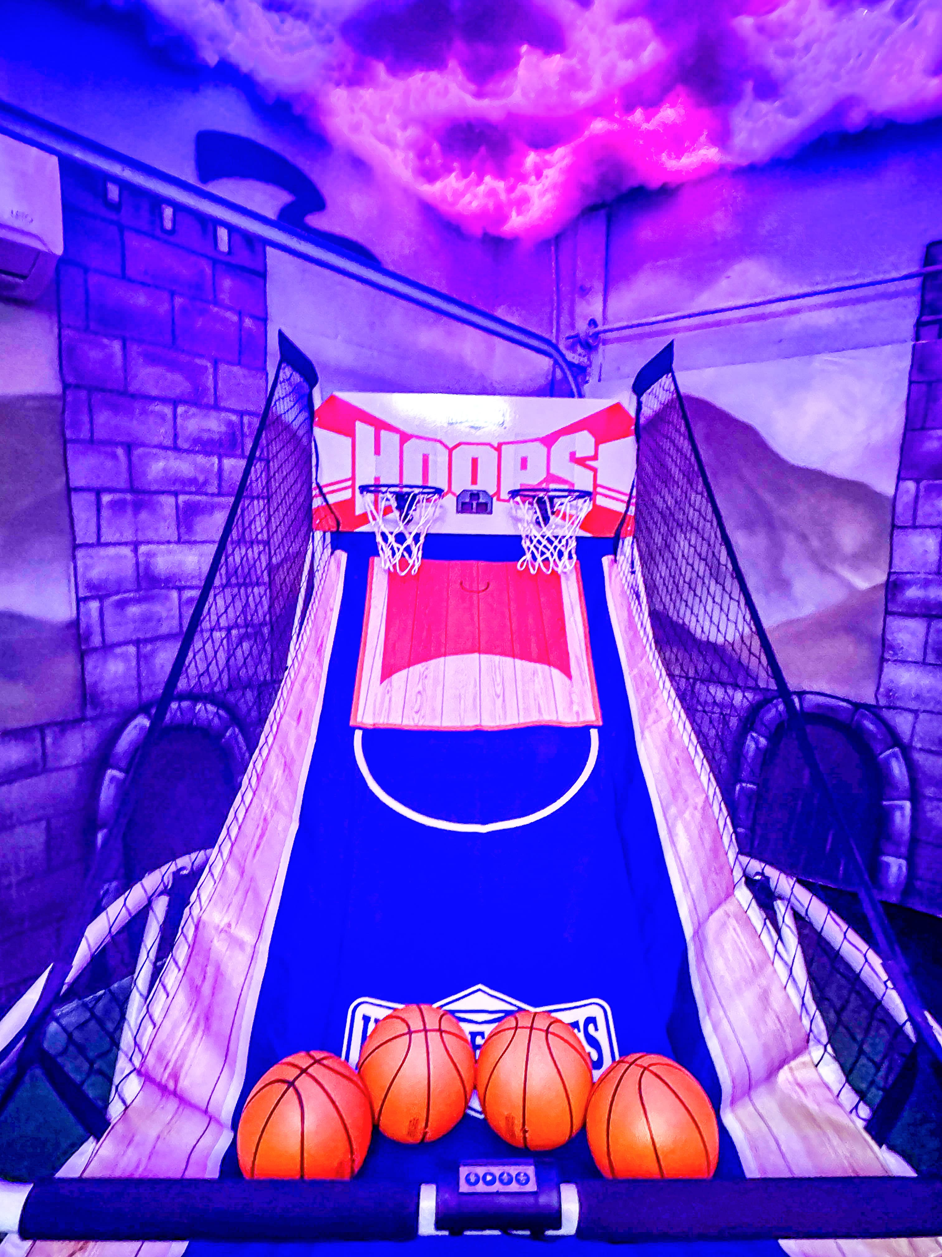 Shoot hoops under a color-changing storm cloud sky while a scene inspired by the Battle of Hogwarts