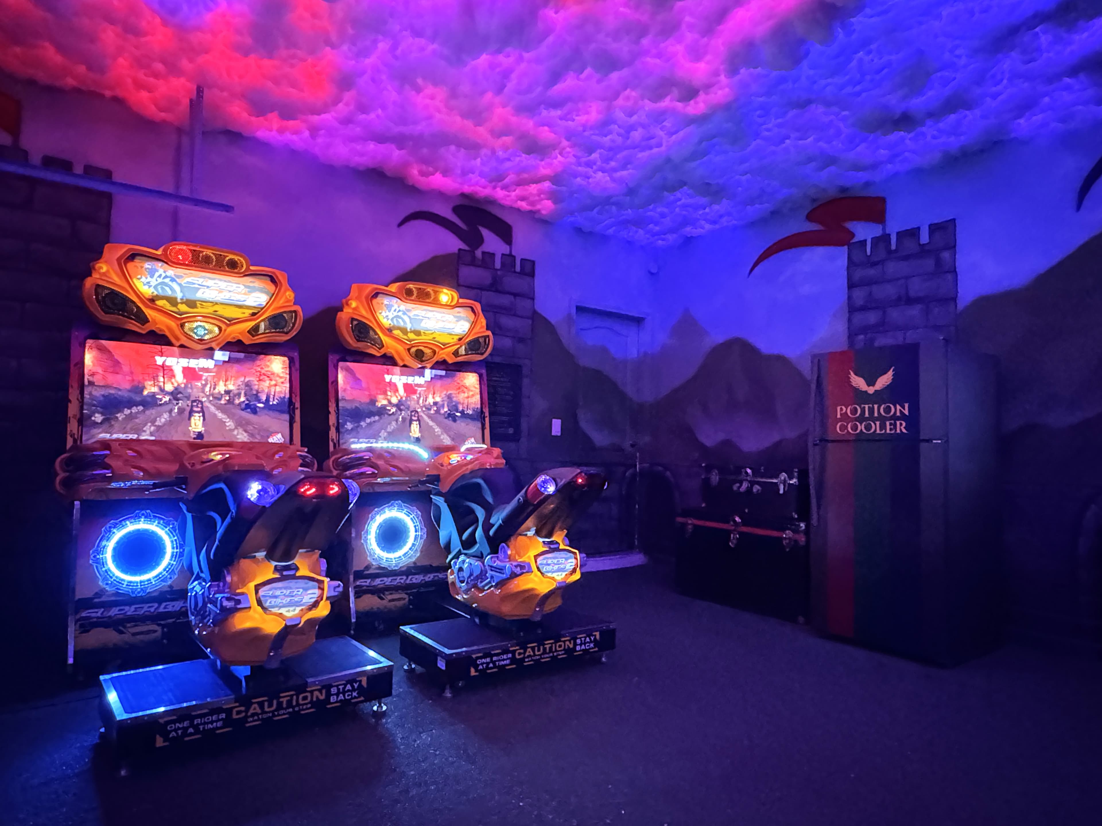 Ducati racing cabs and the Potion Cooler glowing under UV light — kids lose trac