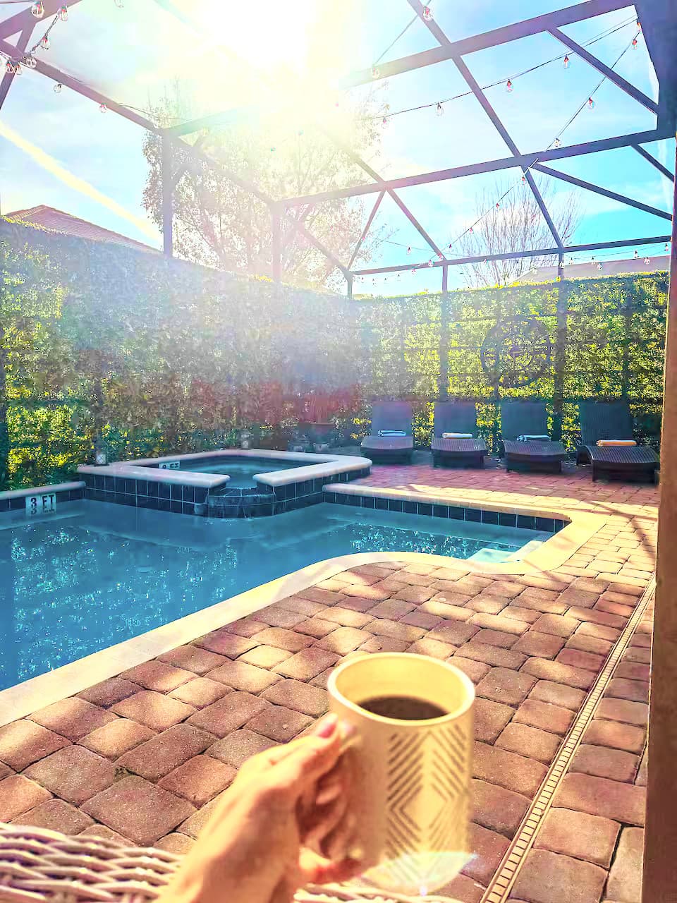 Morning coffee hits different poolside. Warm sun, heated water, and nowhere to b