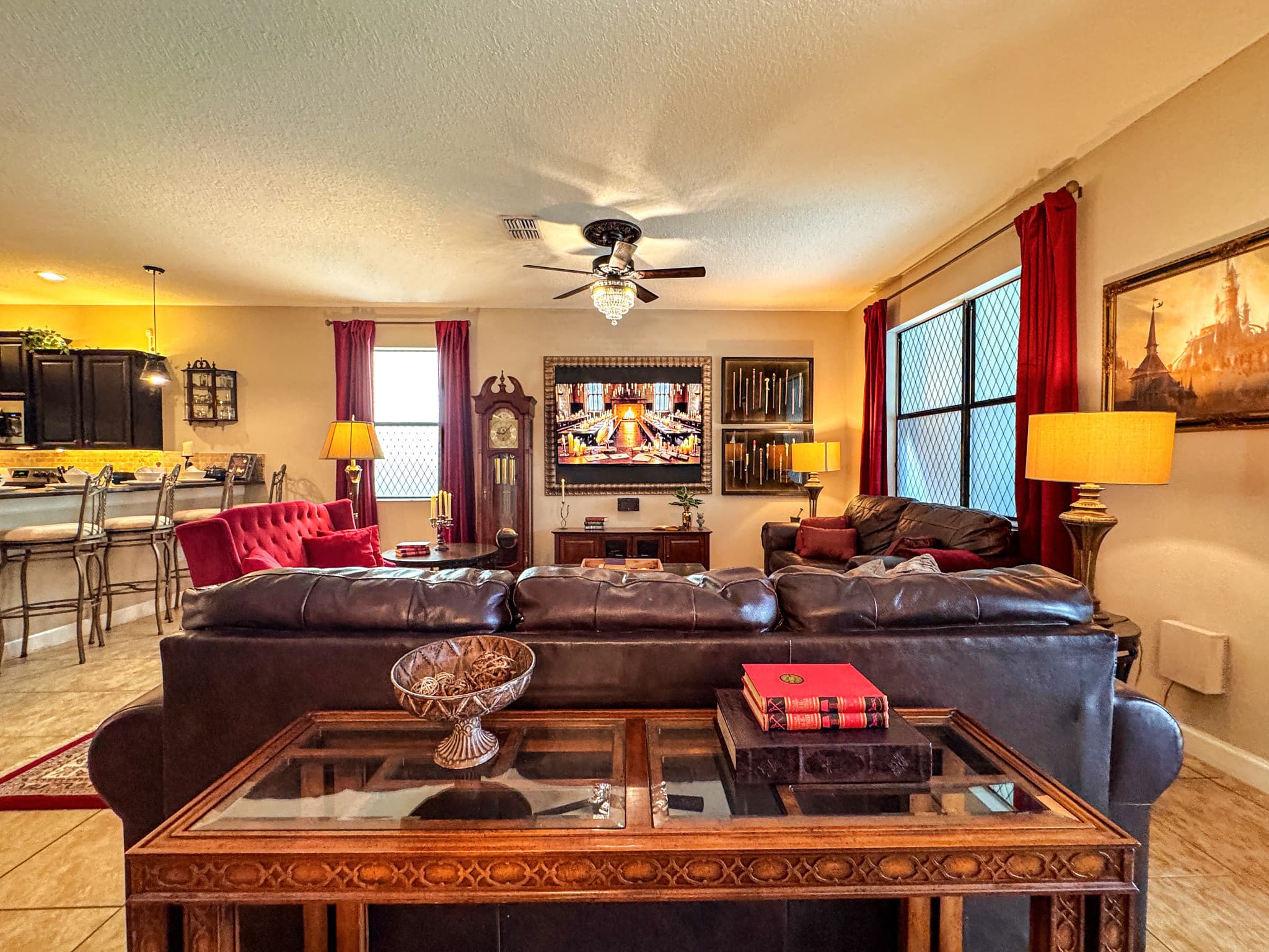 Leather sofas deep enough to disappear into, a basket of throw blankets, a brass