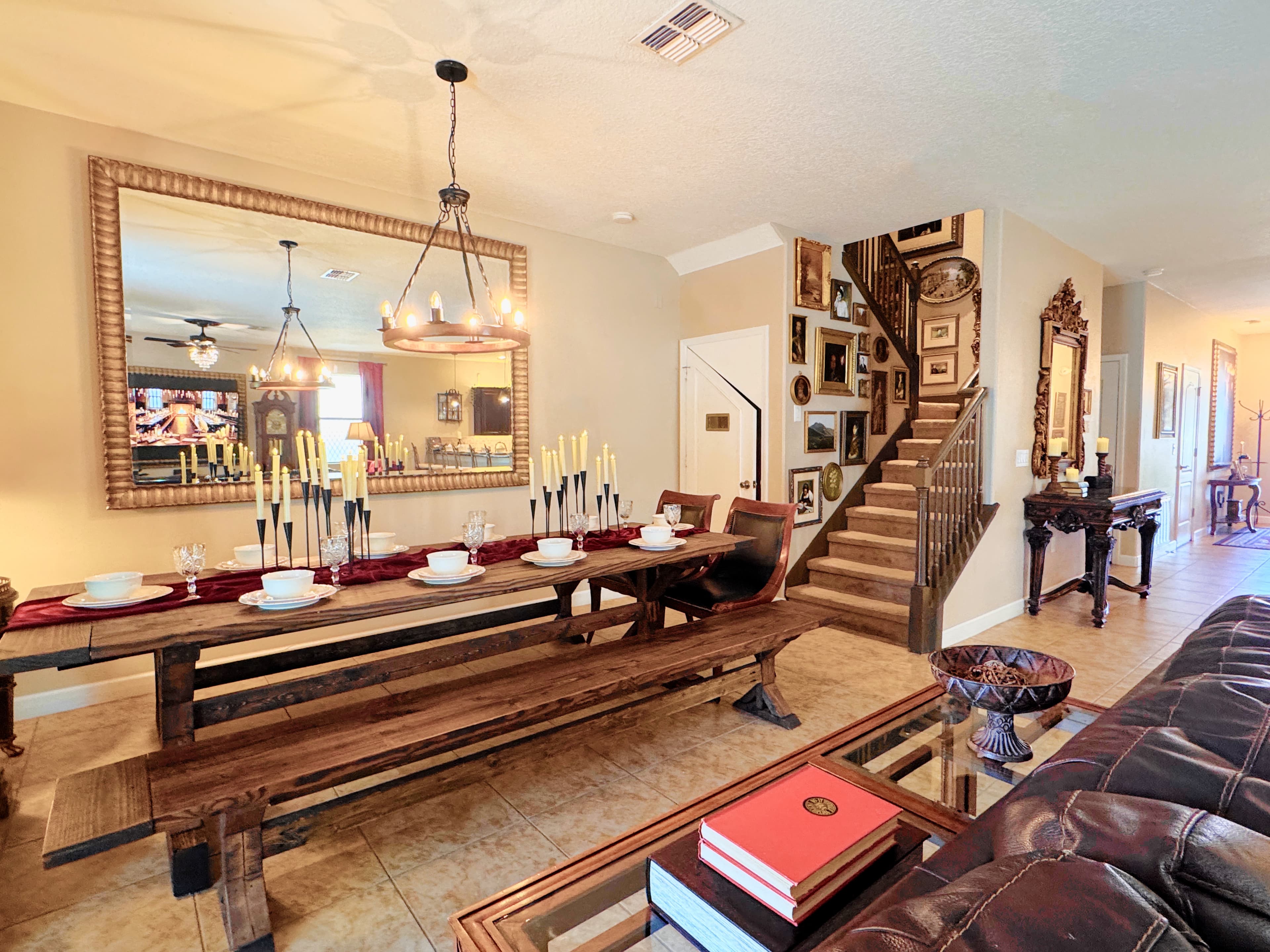 Candelabras glowing, burgundy place settings, golden skeleton keys scattered on