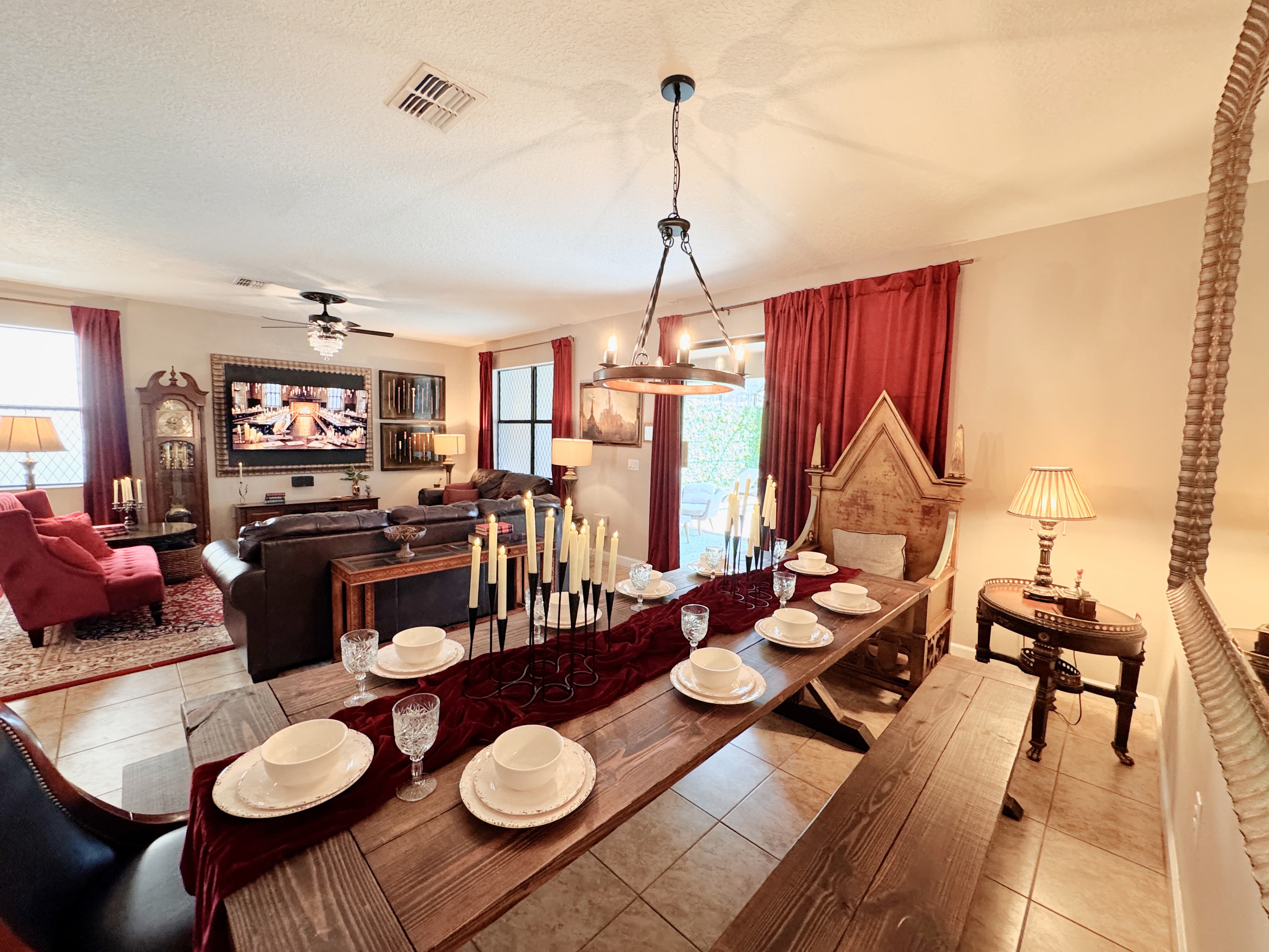 From a throne inspired by Dumbledore’s at the head, the candlelit banquet table stretches towa
