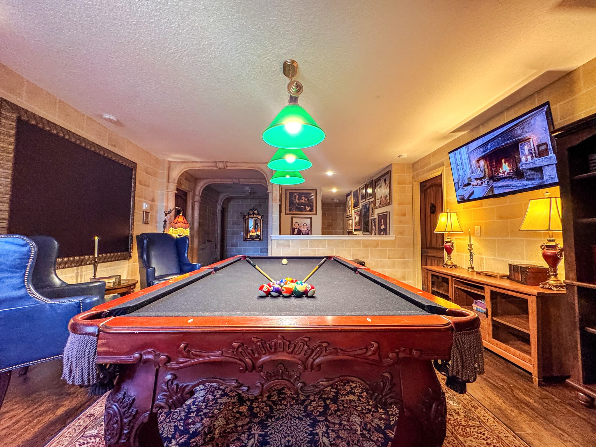 Colorful balls racked tight, a high mount TV waiting for the game, and a Chester