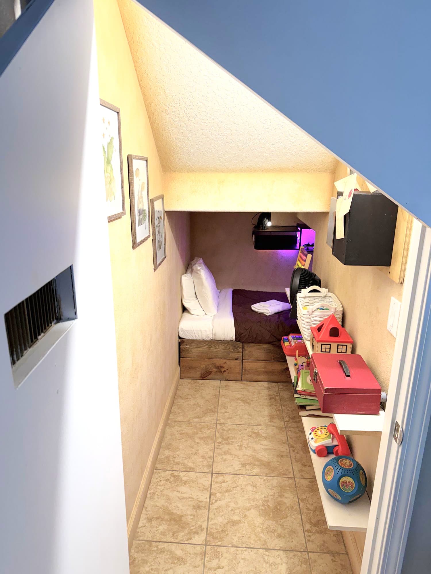 A small glowing door. A cluttered closet — toys, pipes, letters inspired by Hogwarts. Keep w